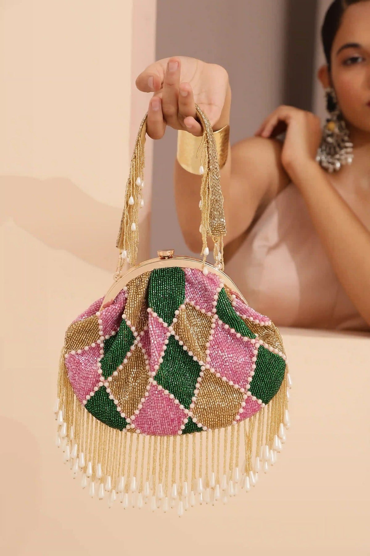 Bliss Batua Bag by The Tan Clan with a detachable handle, showcasing its stylish design and versatile carry options.