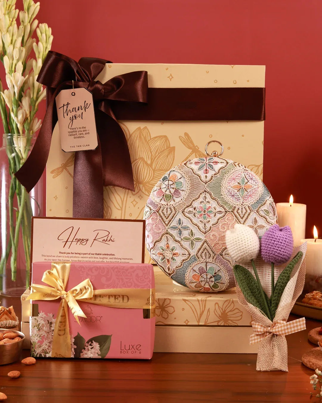 Luxury gift hamper from The Tan Clan with assorted gourmet snacks and personal care items, presented in a stylish basket.