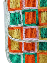 Blossom Blocks Baguette Bag with Handle by The Tan Clan, stylish woven bag featuring a colorful blossom pattern and sturdy handle.