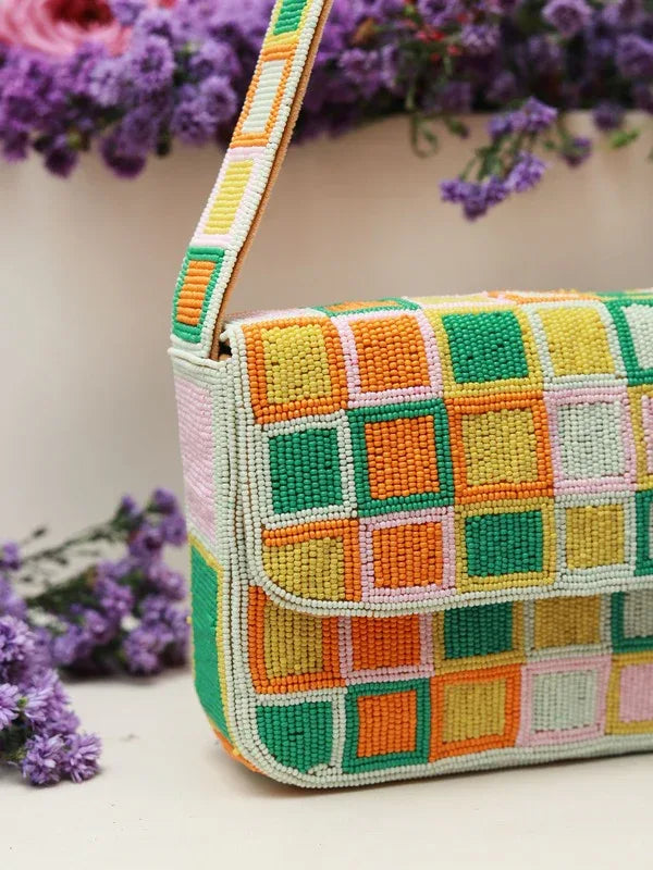 Blossom Blocks Baguette Bag with Handle by The Tan Clan, stylish handbag featuring a colorful Blossom Blocks pattern and top handle.
