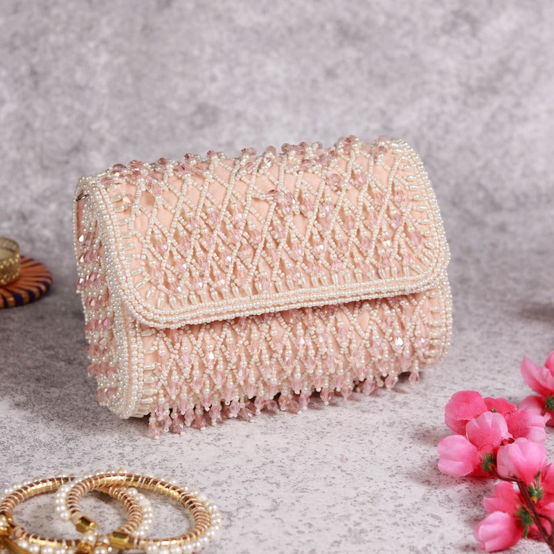 Blush flap over bag with handle from The Tan Clan, featuring a stylish design and spacious interior for everyday use.