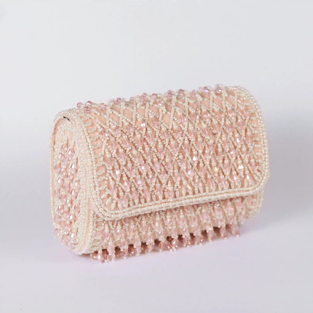 Blush flap over bag with handle from The Tan Clan, featuring a stylish design and spacious interior for everyday use.