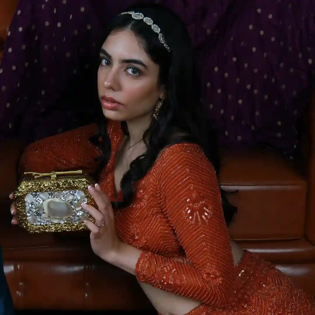 Burj embellished clutch made of agate stone by The Tan Clan, featuring intricate design and polished surface.