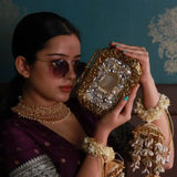 Elegant Burj clutch by The Tan Clan featuring an embellished agate stone design with intricate detailing.