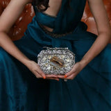 Burj embellished agate stone clutch bag by The Tan Clan with intricate detailing and a sleek, elegant design.