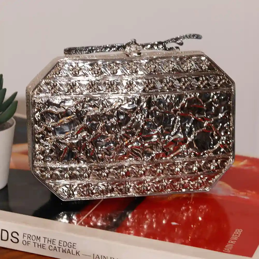 Burj embellished agate stone clutch by The Tan Clan with intricate design and polished agate stone exterior.