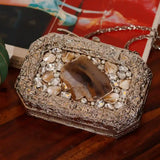 Burj embellished agate stone clutch bag by The Tan Clan with intricate detailing and a polished, elegant design.