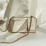 Bushra 3D Mother of Pearl Clutch by The Tan Clan, elegant rectangular evening bag with iridescent pearl surface and metallic clasp.