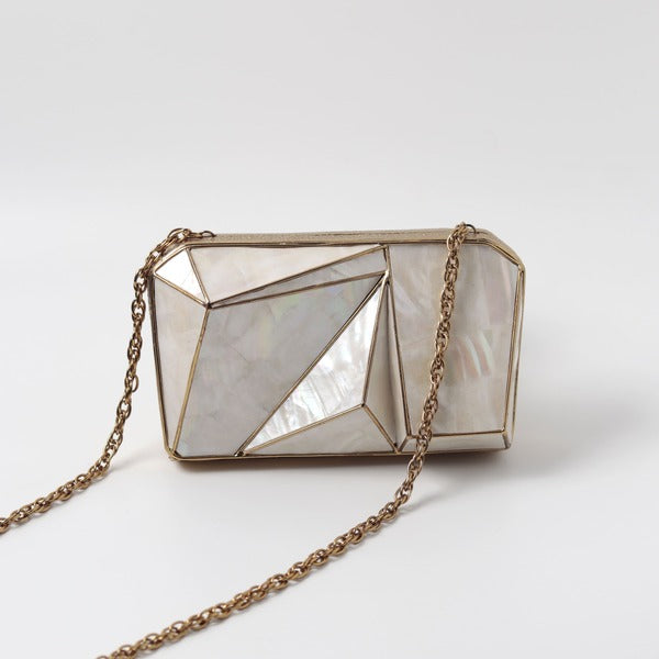 Bushra 3D Mother of Pearl Clutch by The Tan Clan with intricate pearl detailing and elegant design.