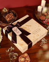 Floral Grace Hamper Poppy by The Tan Clan featuring a bouquet of vibrant flowers and elegant gift packaging.