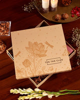 Floral Grace Hamper by The Tan Clan featuring vibrant poppy flowers and elegant gift items in a decorative basket.