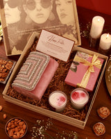 Celebrate Her Hamper by The Tan Clan featuring a luxurious gift box with chocolates, skincare products, and elegant wrapping.