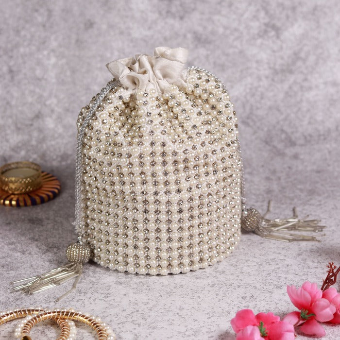 Chhaya Potli bag by The Tan Clan with embroidered handle, featuring intricate embroidery and traditional design.