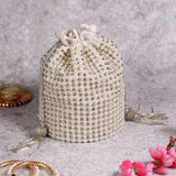Chhaya Potli bag by The Tan Clan with embroidered handle, featuring intricate embroidery and traditional design.