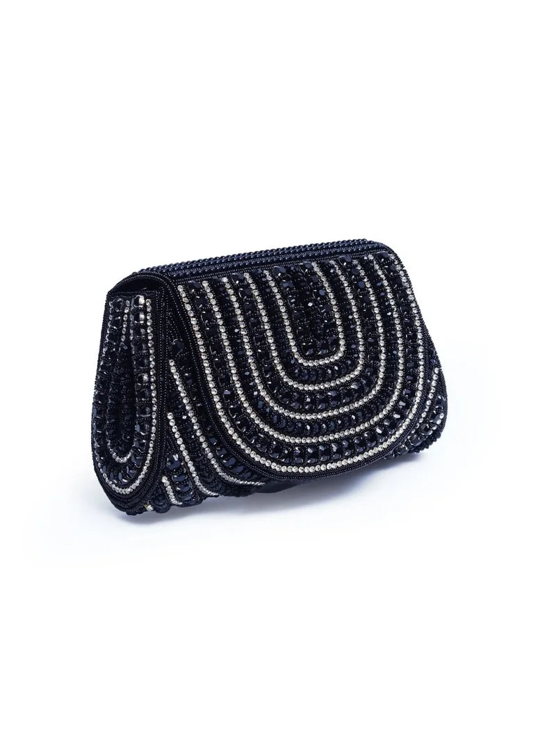 Chloe black flap-over bag with handle from The Tan Clan, stylish and functional accessory with sleek design and secure closure.