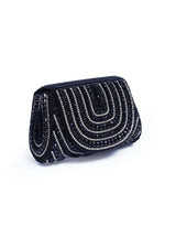 Chloe black flap-over bag with handle from The Tan Clan, stylish and functional accessory with sleek design and secure closure.