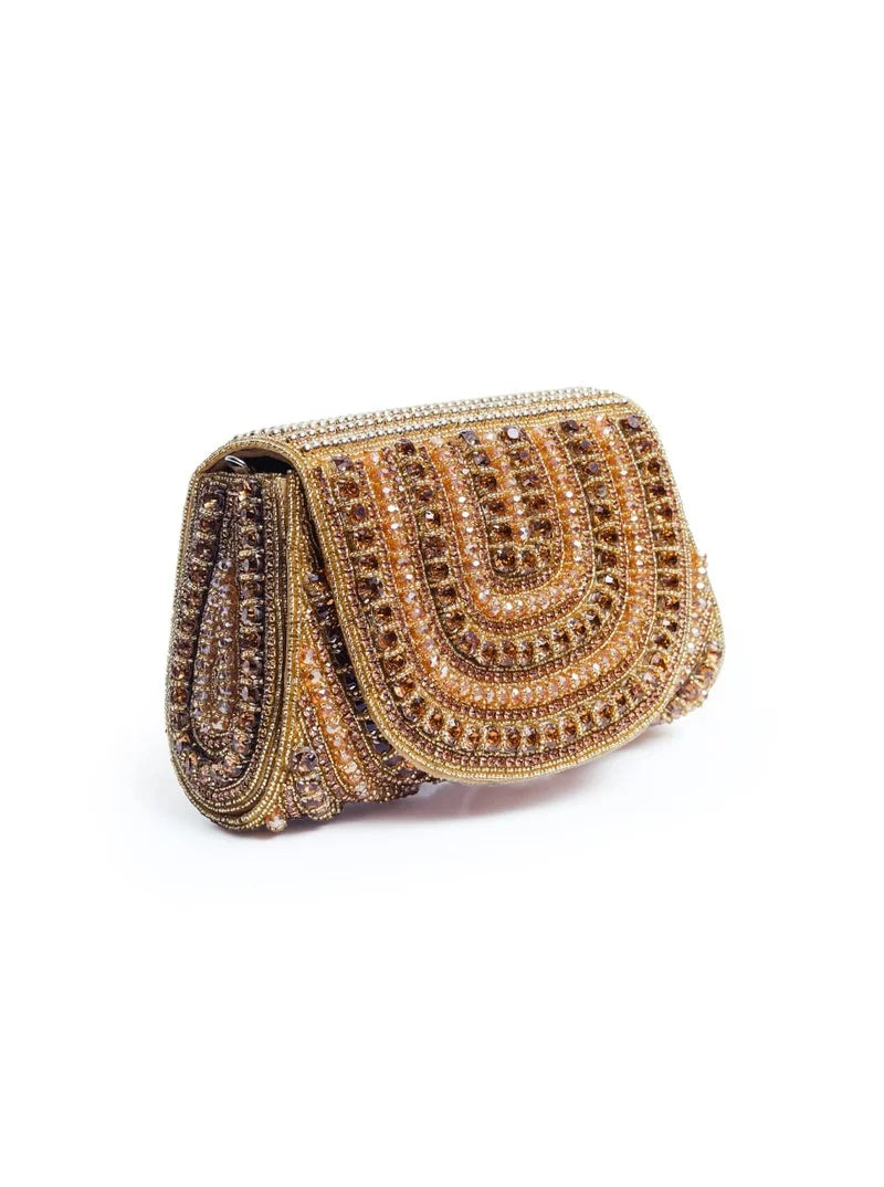 Chloe gold flap-over bag with handle featuring sleek design and stylish gold hardware, perfect for everyday use.