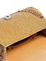 Chloe gold flap-over bag with handle and structured design, featuring sleek gold hardware and a top handle for versatile style.