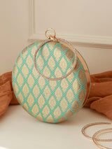 Green round clutch purse by The Tan Clan with a sleek, minimalist design and compact shape for stylish accessories.