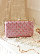 Pink box clutch by The Tan Clan featuring a sleek classic design with a smooth surface and elegant closure.