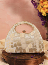 Beige Coral Arc clutch bag by The Tan Clan with a sleek, curved design and elegant texture, perfect for stylish occasions.