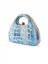 Coral Arc Blue Clutch by The Tan Clan featuring a sleek design, vibrant coral color, and a compact, stylish shape.