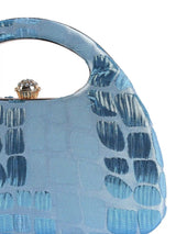 Coral Arc Blue Clutch by The Tan Clan featuring a sleek design and vibrant coral color, perfect for stylish evening accessories.