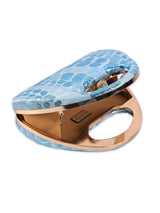 Coral Arc Blue Clutch by The Tan Clan featuring a vibrant coral and blue color scheme with elegant arc design.