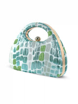 Coral Arc Green Clutch by The Tan Clan featuring a sleek design and vibrant coral color for stylish accessories.