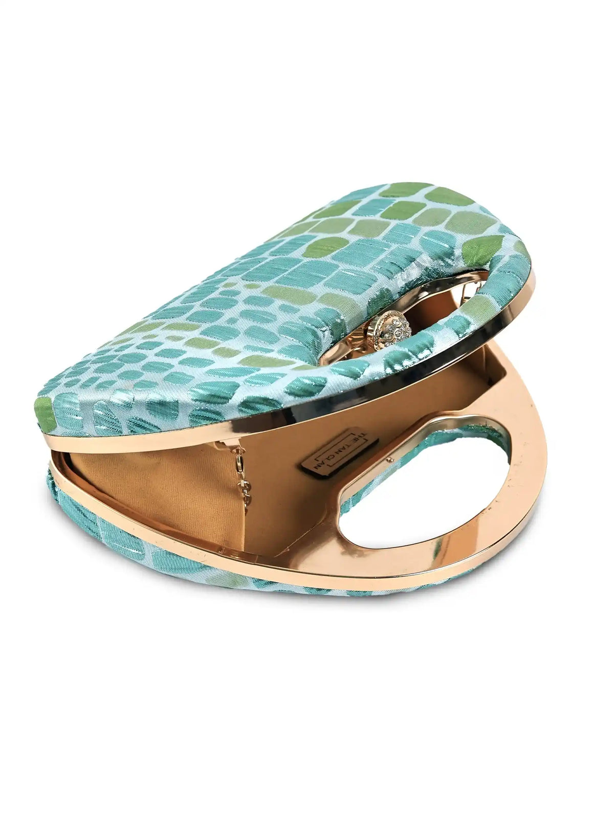 Coral Arc Green Clutch by The Tan Clan featuring a sleek curved design and vibrant coral green color, perfect for stylish occasions.