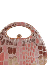 Coral Arc Peach Clutch by The Tan Clan featuring a sleek, curved design with a textured finish and gold-tone clasp.