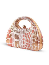 Coral Arc Peach Clutch by The Tan Clan featuring a sleek, curved design and vibrant peach color, ideal for elegant occasions.