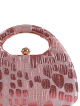 Coral Arc Pink Clutch by The Tan Clan featuring a sleek curved design and vibrant pink color.