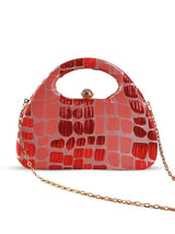 Coral Arc Red Clutch bag by The Tan Clan featuring a sleek, curved design with a gold clasp and stylish finish.