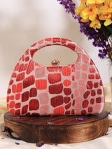 Red coral arc clutch by The Tan Clan with sleek design and gold-tone accents, perfect for evening or special occasions.
