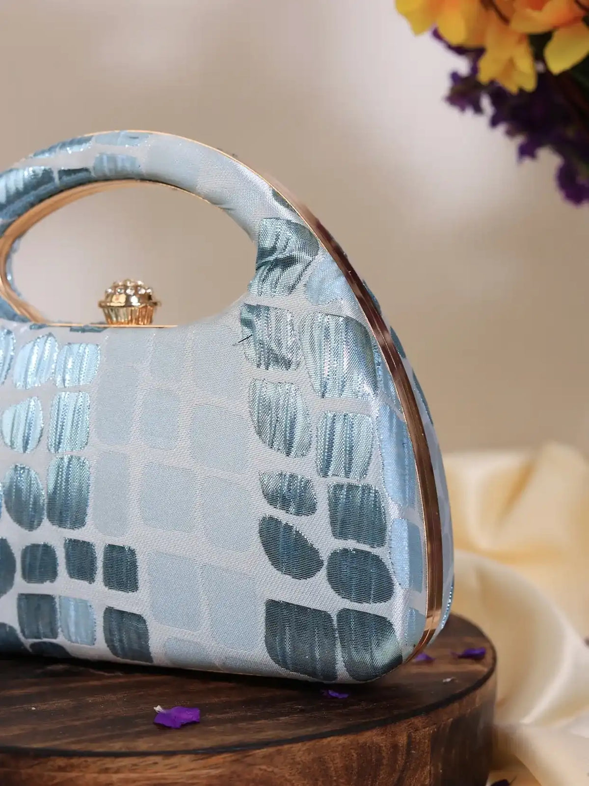 Blue Coral Arc clutch bag by The Tan Clan, featuring a stylish design perfect for weddings and special occasions.