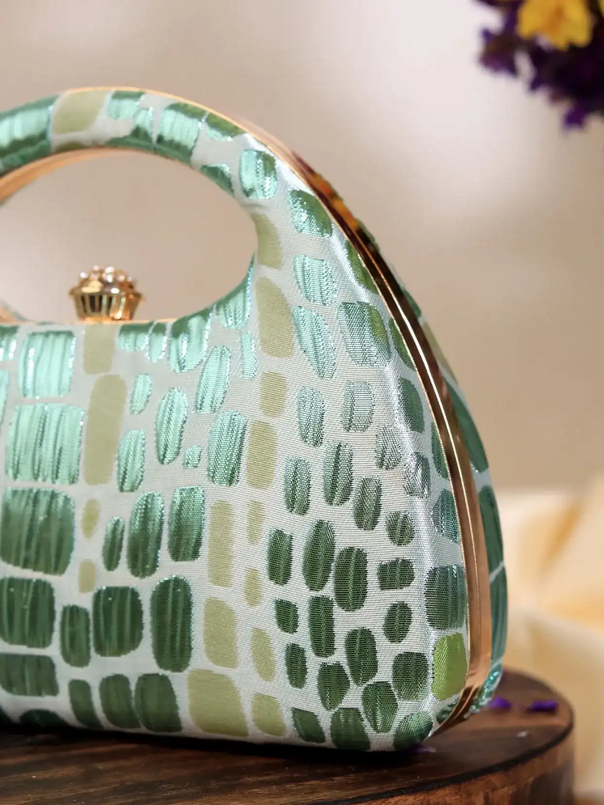 Green Coral Arc clutch bag by The Tan Clan, featuring a stylish design perfect for weddings and special occasions.