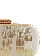 Long beige coral clutch bag by The Tan Clan, featuring a sleek design and textured finish.