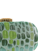 Coral long green clutch by The Tan Clan, featuring a sleek design with a vibrant coral and green color combination.