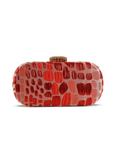 Red coral long clutch purse by The Tan Clan with a sleek, elegant design and a zip closure.
