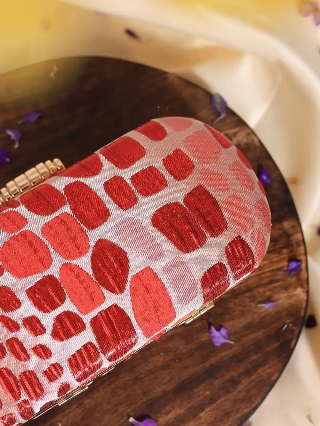 Set of five coral long red clutches by The Tan Clan, ideal as wedding favors or elegant accessories.