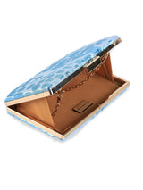 Coral Sleek Blue Clutch by The Tan Clan, featuring a slim design and vibrant color, with a textured surface and elegant clasp.