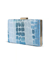 Coral Sleek Blue Clutch by The Tan Clan featuring a slim design, textured surface, and elegant style for evening occasions.