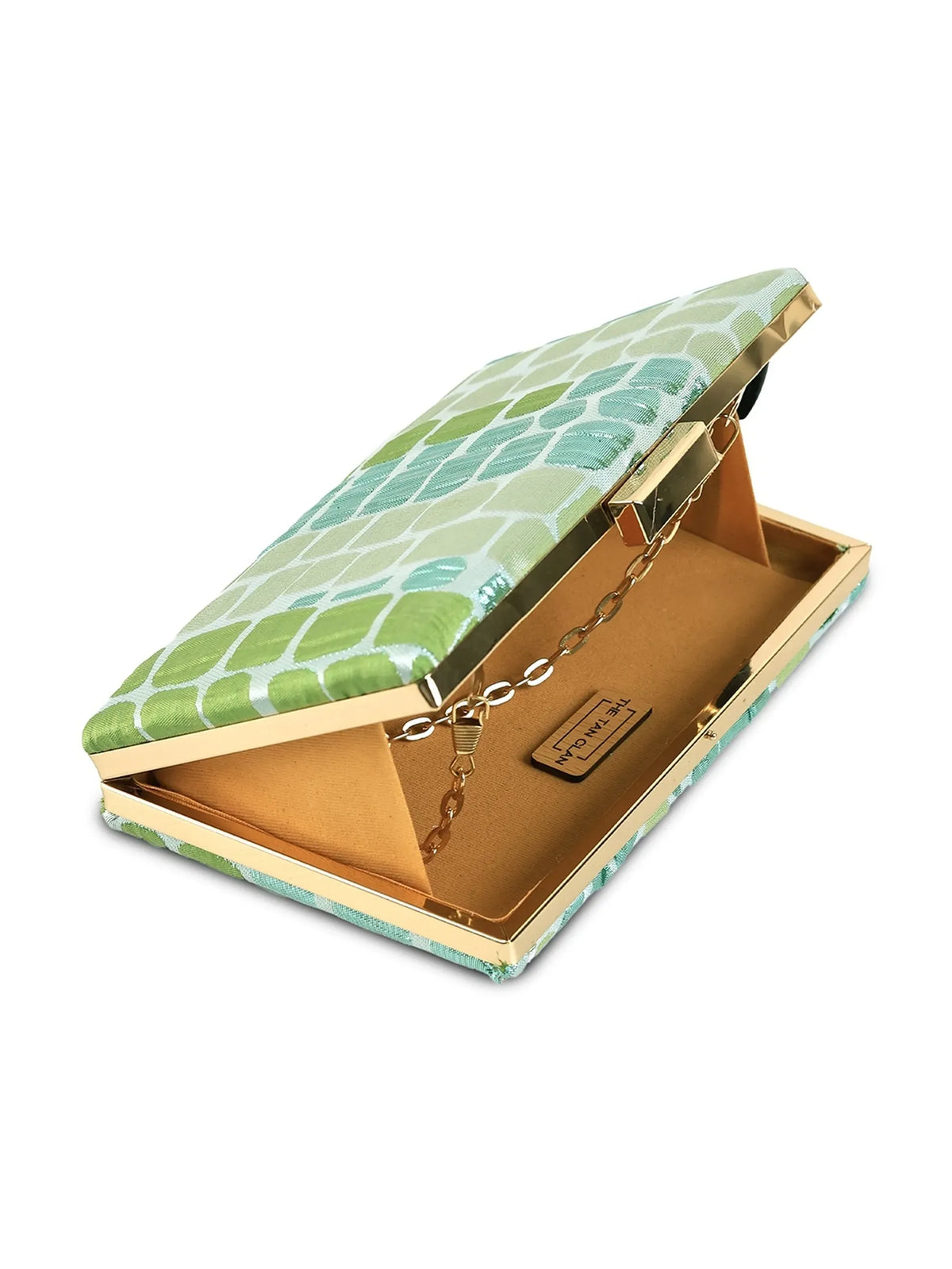 Coral sleek green clutch by The Tan Clan showing its minimalist design and vibrant coral color with a smooth finish.