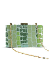 Coral sleek green clutch by The Tan Clan, featuring a stylish design with a smooth texture and compact size.