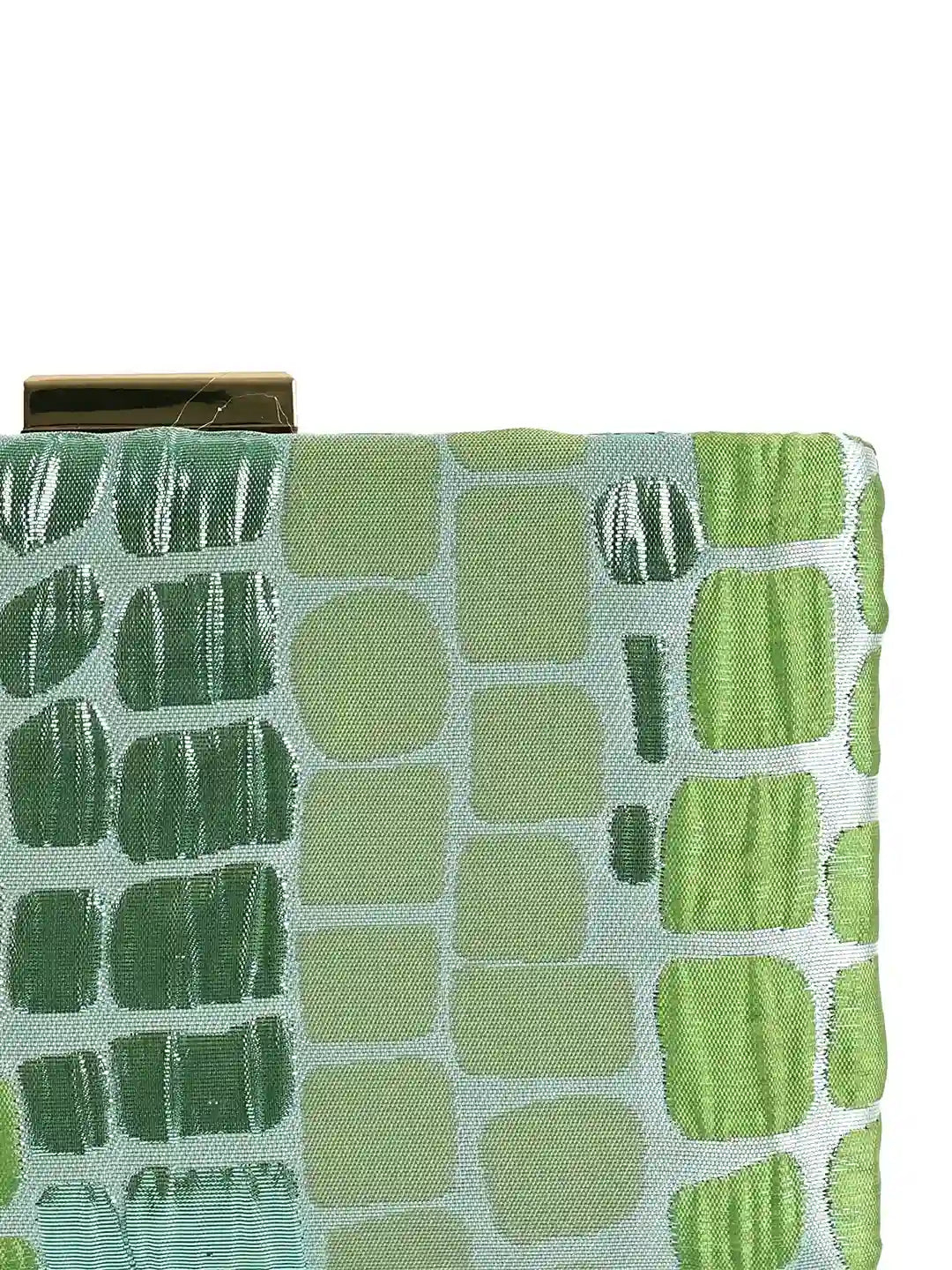 Coral sleek green clutch by The Tan Clan, featuring a compact design with a textured exterior and elegant gold-tone clasp.