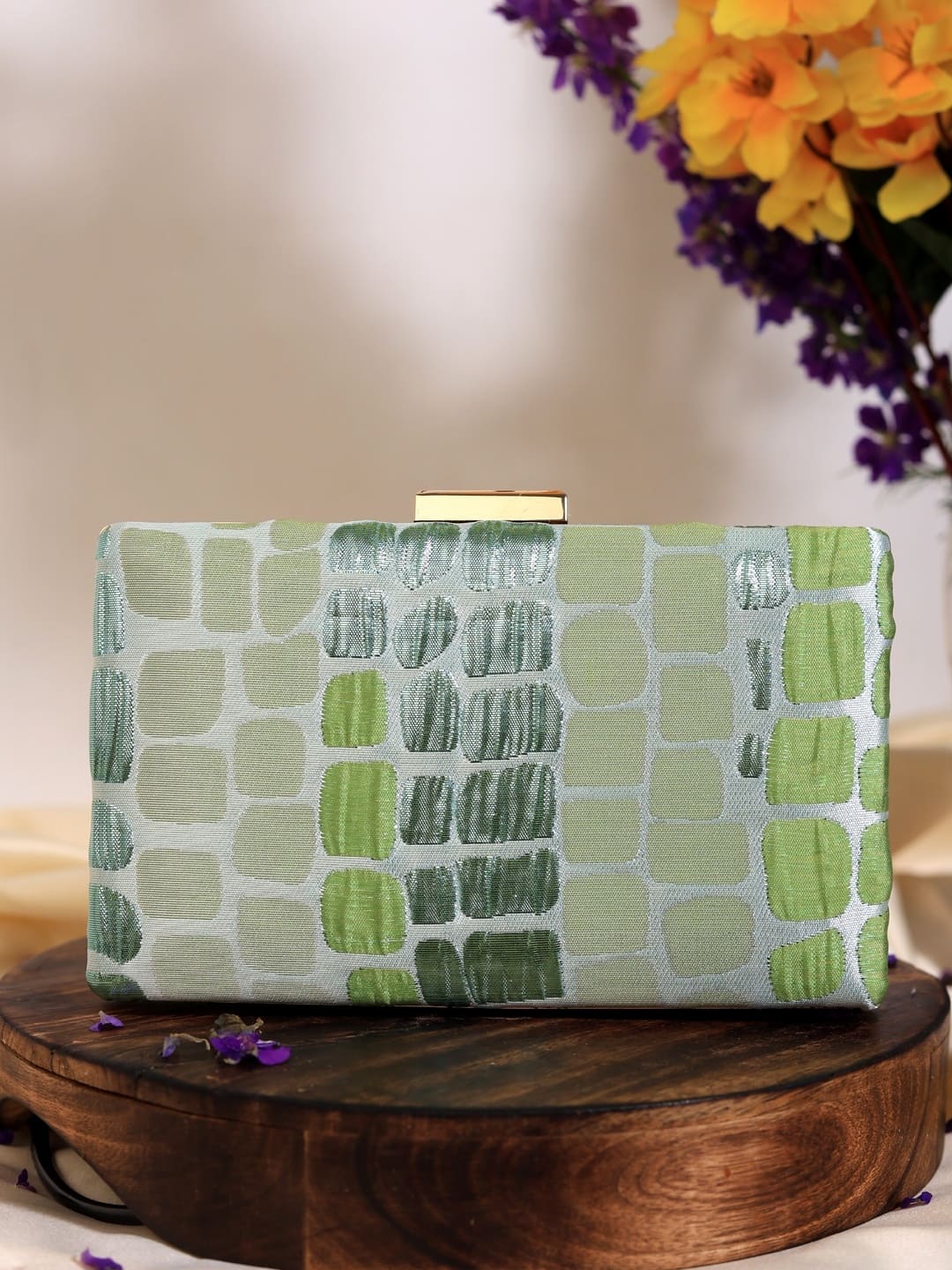 Coral Sleek Green Clutch by The Tan Clan featuring a compact design and vibrant coral-green color, perfect for evening accessories.