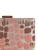 Coral Sleek Peach Clutch by The Tan Clan with a smooth, compact design and elegant gold clasp on a neutral background.