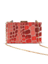 Coral Sleek Red Clutch by The Tan Clan featuring a smooth finish and compact design, perfect for evening occasions.