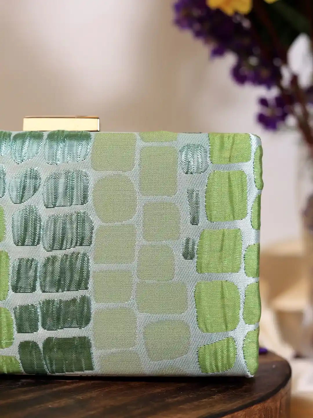 Coral Sleek Green Clutch by The Tan Clan, elegant and compact accessory with a smooth finish, perfect for special occasions.